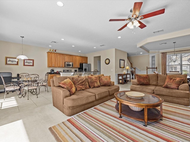 tiled living room with ceiling fan