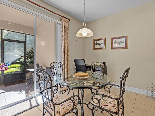 dining space featuring light tile patterned floors