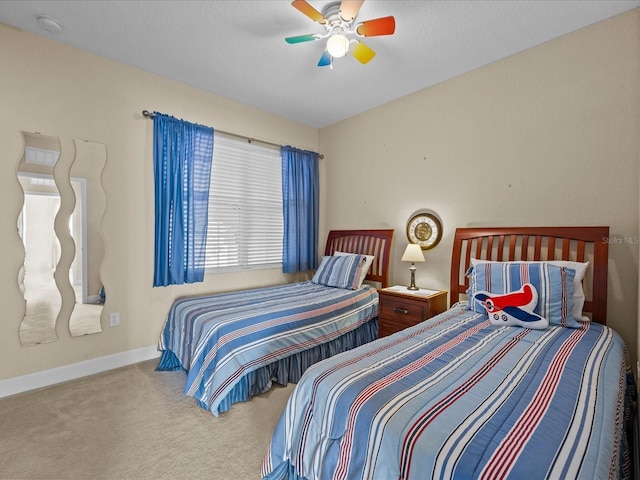 bedroom with ceiling fan and light colored carpet