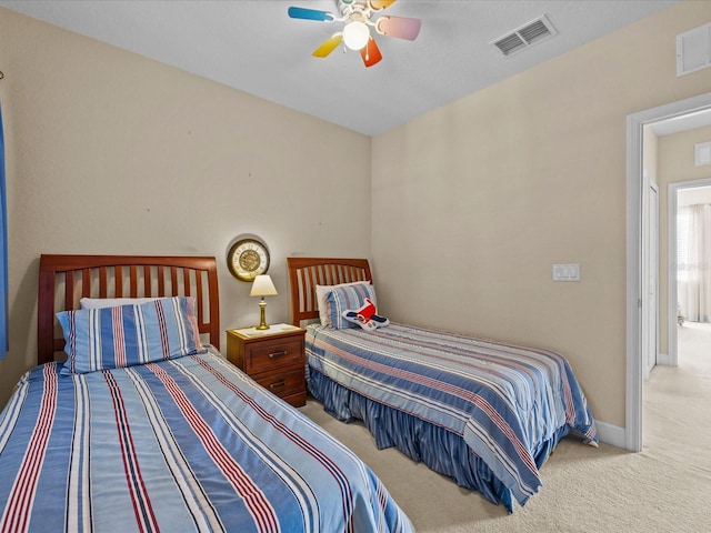 carpeted bedroom featuring ceiling fan