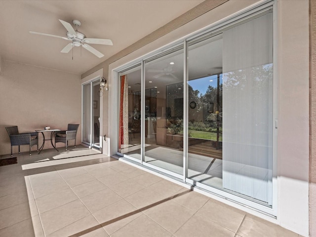 view of patio / terrace featuring ceiling fan