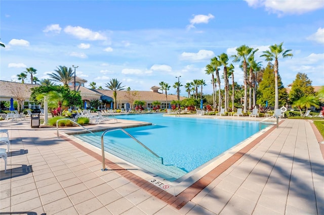 view of swimming pool with a patio area