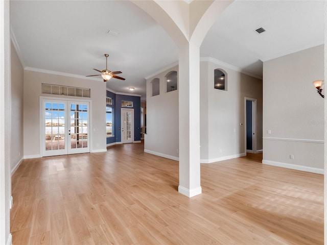 unfurnished living room featuring ceiling fan, light hardwood / wood-style flooring, french doors, and ornamental molding