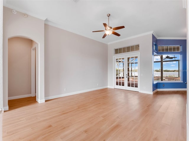 unfurnished living room with french doors, light hardwood / wood-style floors, ceiling fan, and crown molding