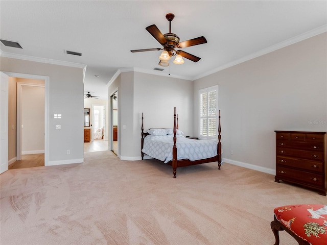 carpeted bedroom with ceiling fan and ornamental molding