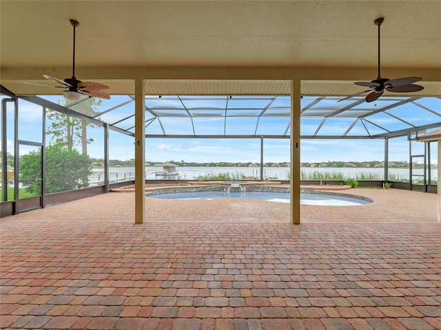 view of patio / terrace featuring a lanai, pool water feature, a water view, and ceiling fan