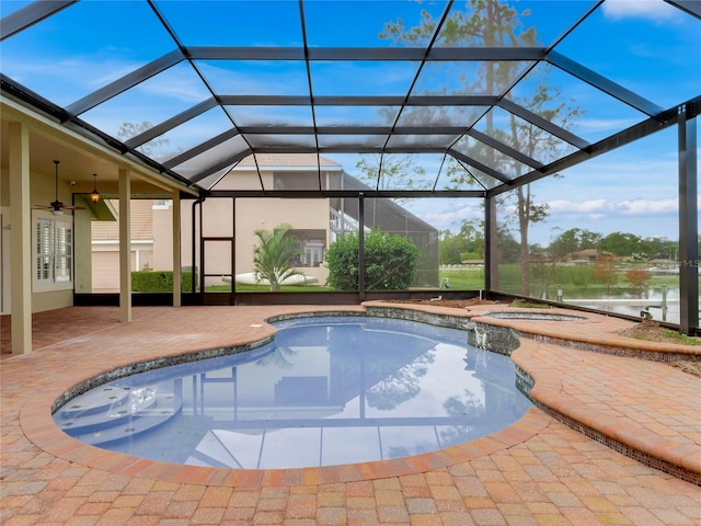 view of swimming pool featuring ceiling fan, a lanai, a patio, and a water view