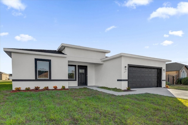 view of front facade featuring a front yard and a garage