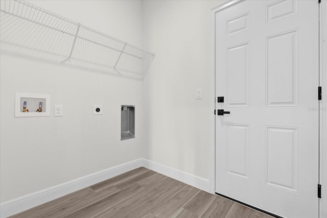 washroom featuring hookup for a washing machine, light wood-type flooring, and electric dryer hookup