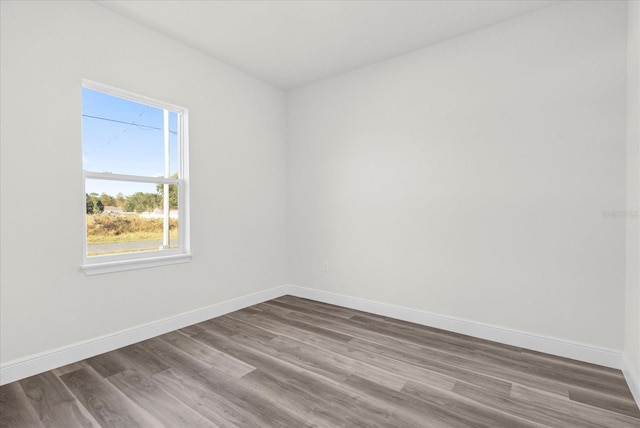 unfurnished room featuring hardwood / wood-style floors