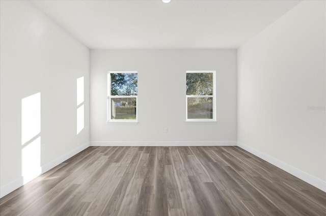 unfurnished room featuring hardwood / wood-style floors