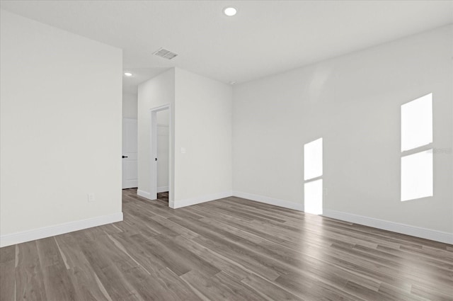 empty room featuring wood-type flooring