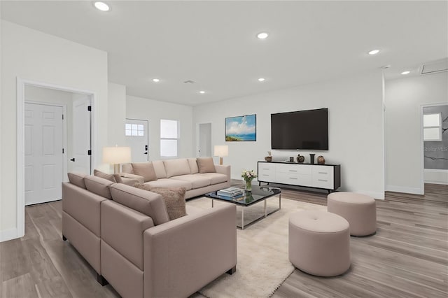 living room with light hardwood / wood-style floors