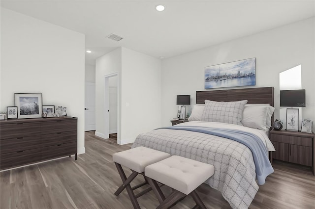 bedroom with hardwood / wood-style flooring