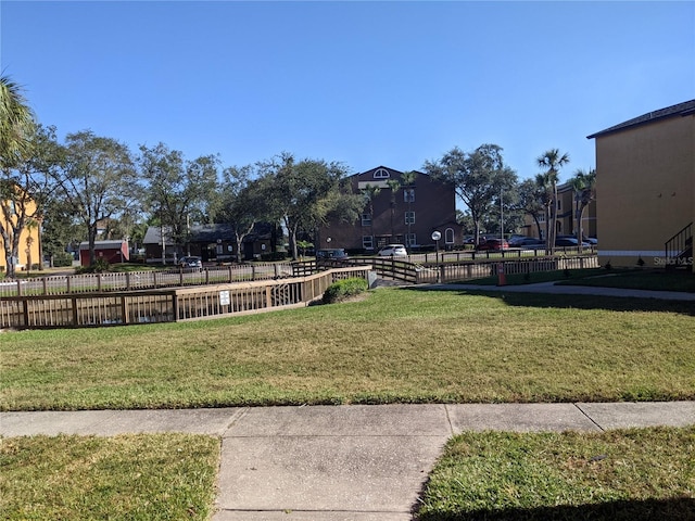 view of property's community featuring a yard