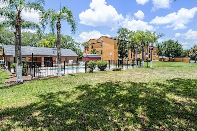 view of yard with a community pool