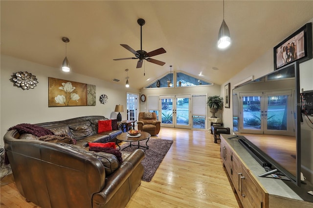 living room with french doors, light wood-type flooring, vaulted ceiling, and ceiling fan