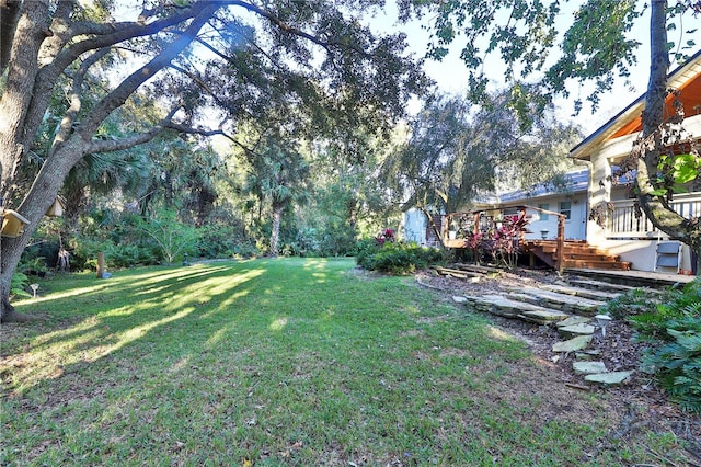 view of yard featuring a wooden deck