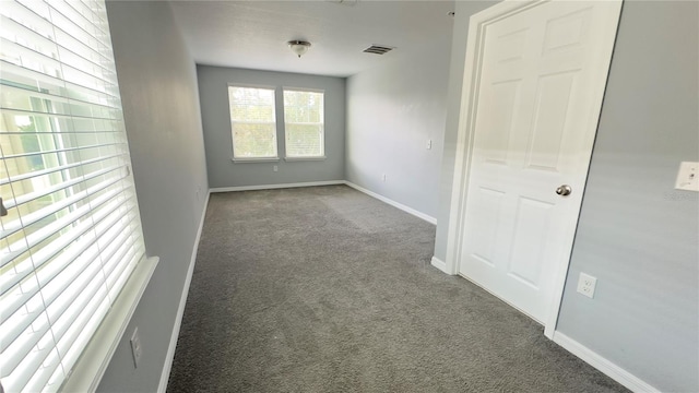 spare room featuring carpet floors