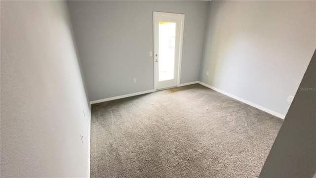 spare room featuring carpet floors