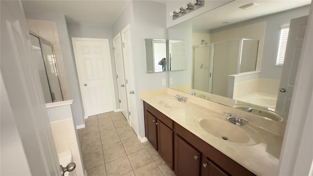 bathroom with tile patterned floors, vanity, and independent shower and bath