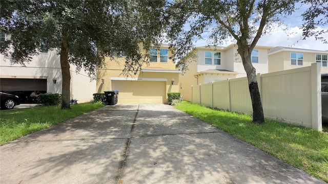 townhome / multi-family property featuring a garage