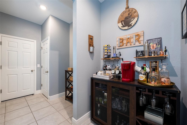 bar featuring light tile patterned flooring