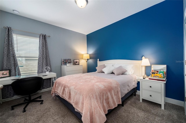 bedroom featuring dark carpet