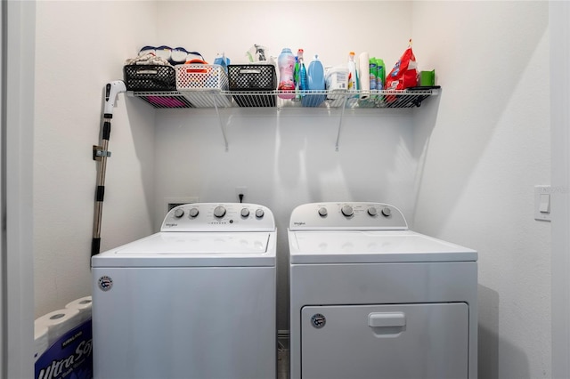 washroom with separate washer and dryer