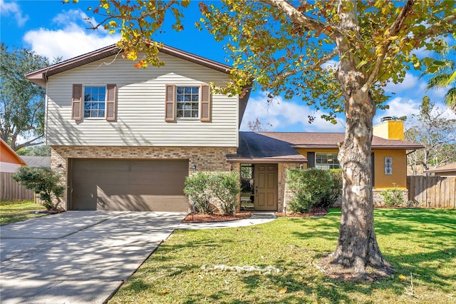 view of front of house with a front lawn and a garage