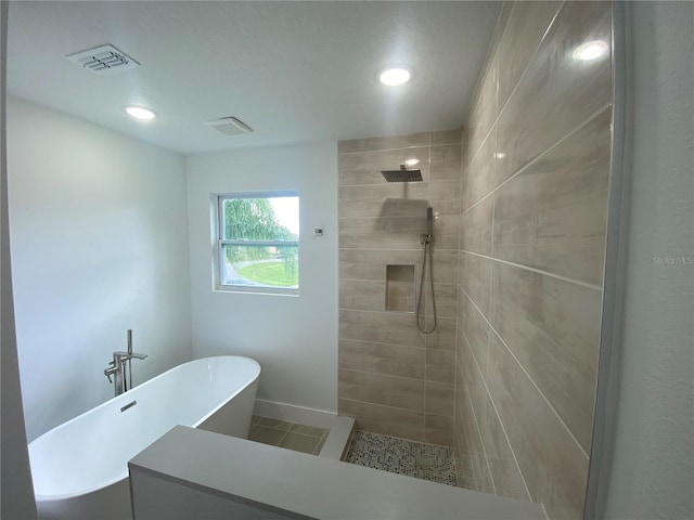 bathroom with separate shower and tub