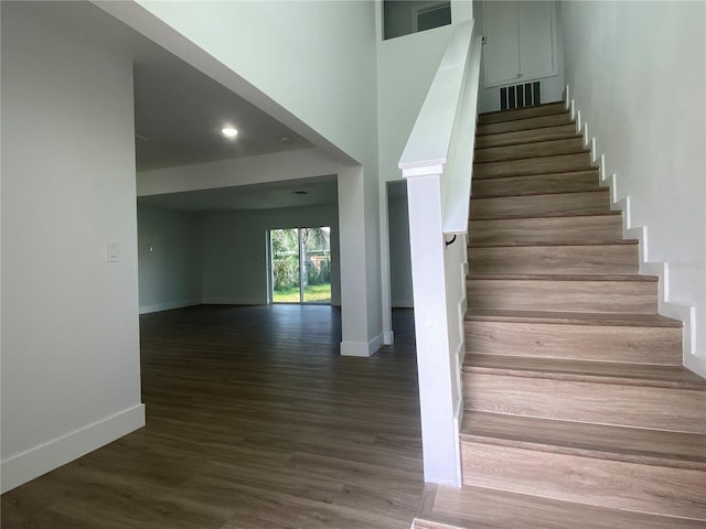 stairway with wood-type flooring