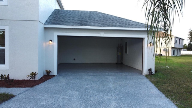 garage with electric water heater and a yard