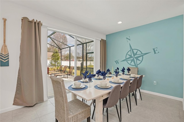 dining area featuring light tile patterned flooring