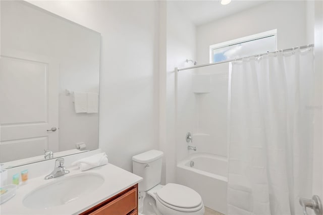 full bathroom with shower / tub combo with curtain, vanity, and toilet