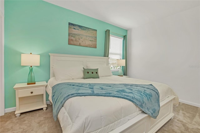 bedroom featuring light colored carpet