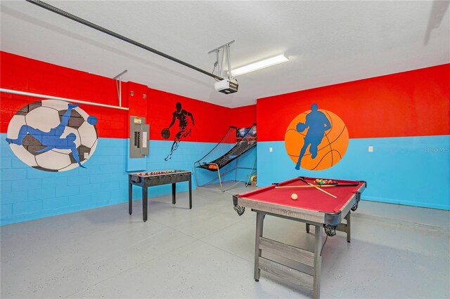 playroom with a textured ceiling, electric panel, and billiards