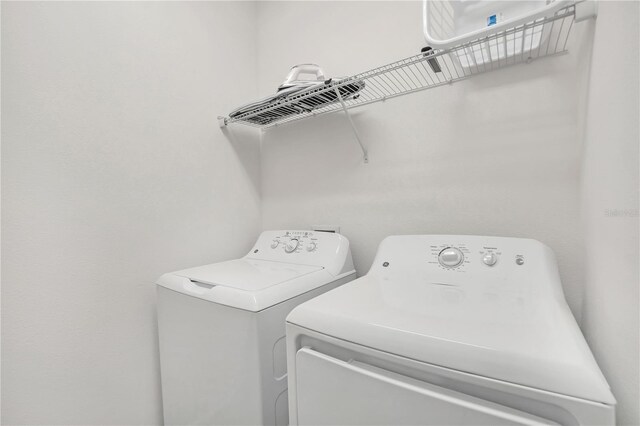 washroom featuring independent washer and dryer