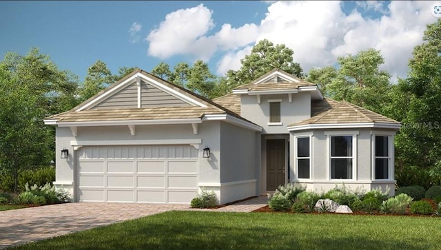 front facade with a front yard and a garage