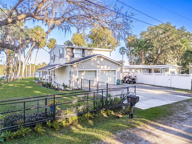 view of front of home with a garage and a front lawn