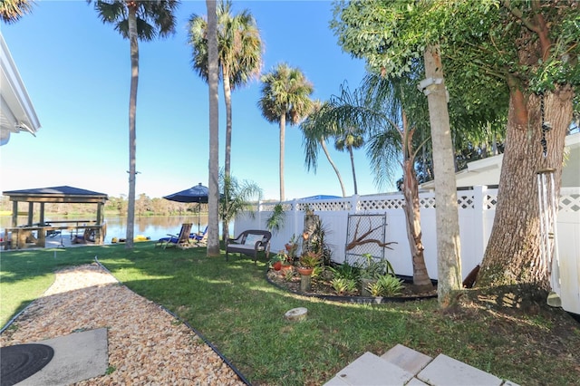 view of yard with a gazebo and a water view