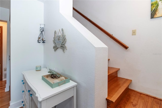 stairway with wood-type flooring