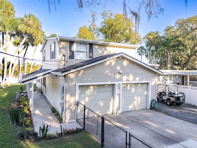 view of front of property with a garage