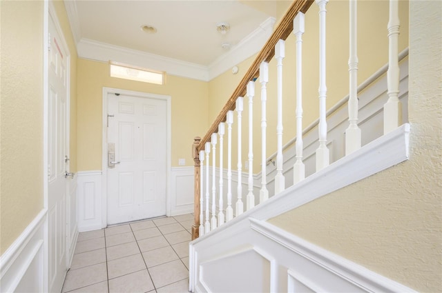 tiled entryway with ornamental molding