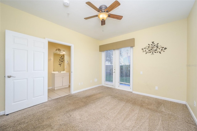 carpeted empty room with ceiling fan