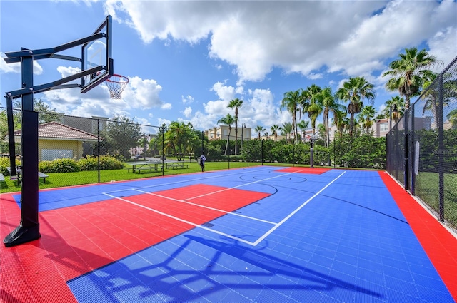 view of sport court featuring a yard