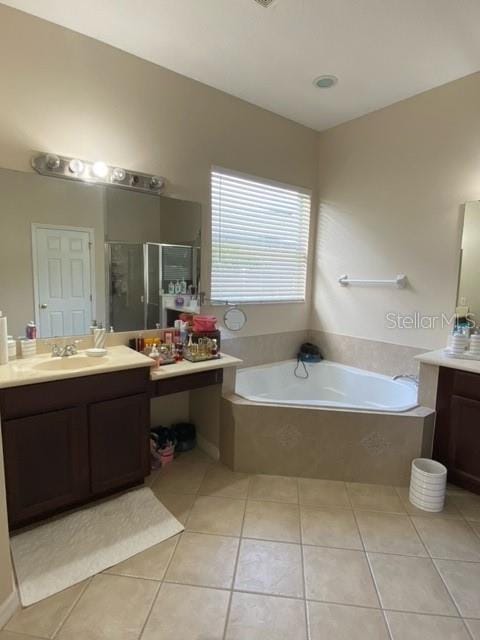 bathroom with vanity, separate shower and tub, and tile patterned floors