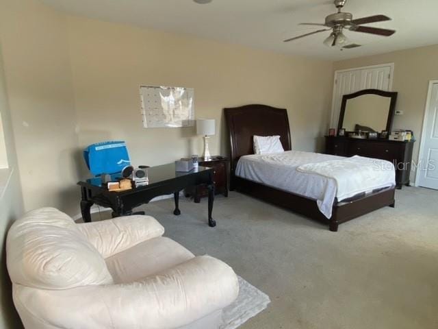 bedroom featuring ceiling fan and light colored carpet