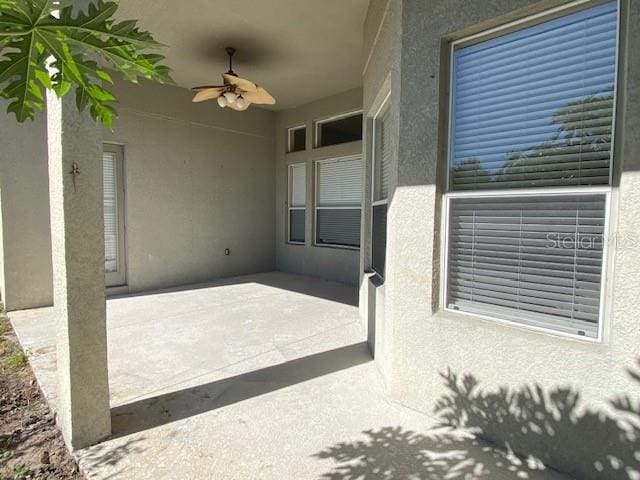 view of patio / terrace featuring ceiling fan