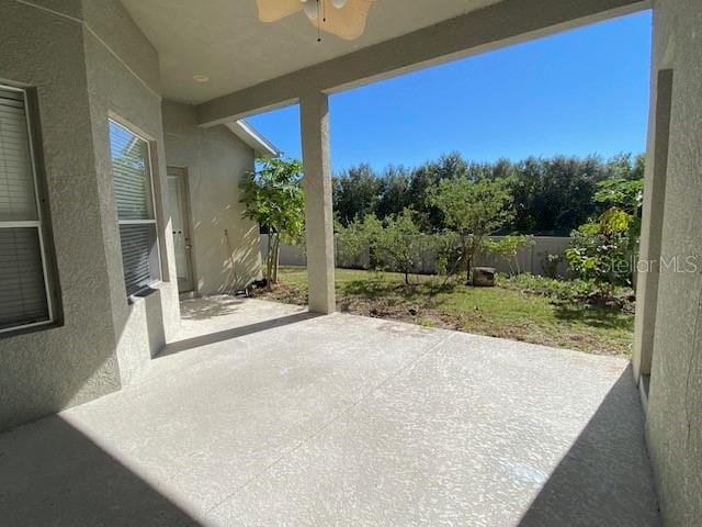 view of patio featuring ceiling fan